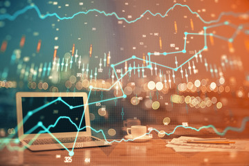 Financial graph colorful drawing and table with computer on background. Multi exposure. Concept of international markets.