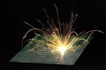 Bright burning sparks fly from the chip