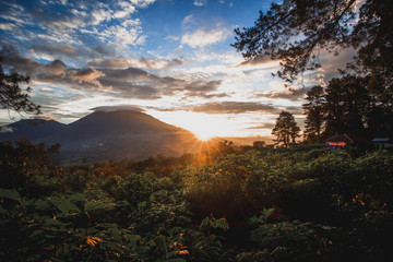 a view from the back of Mount Merapi looking towards Mount Singglang at sunset looks very beautiful and a peaceful atmosphere of nature, West Sumatra