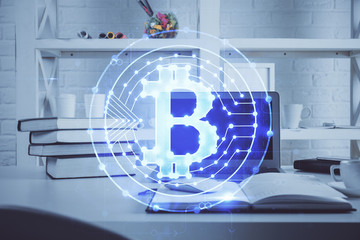 Multi exposure of blockchain theme hologram and table with computer background. Concept of bitcoin crypto currency.