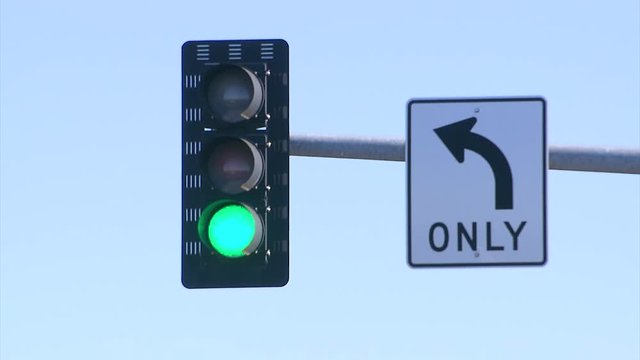 TRAFFIC LIGHT TURNS FROM RED TO GREEN