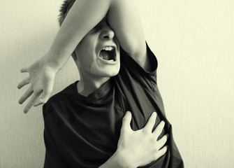 Teenager holds his chest photos in an old-fashioned style