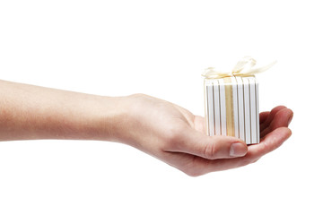 Hand gives a gift isolated on a white background.