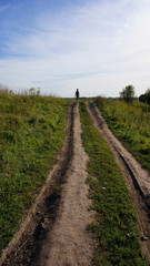 Fototapeta na wymiar path among the vegetation, a child going up it