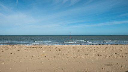 Fototapeta na wymiar Empty sandy beach on a sunny day in Margate, England