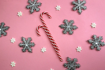 texture a sweet cane of red and white candy surrounded by snowflakes