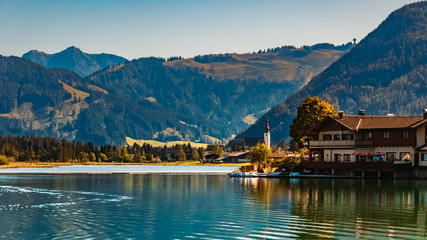 Fototapeta premium Beautiful alpine view with reflections in the famous piller lake at Saint Ulrich, Tyrol, Austria