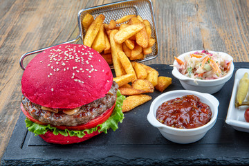 Red bread, burgers. American beefsteak burgers hamburgers pickles, ketchup, mayonnaise and fried...