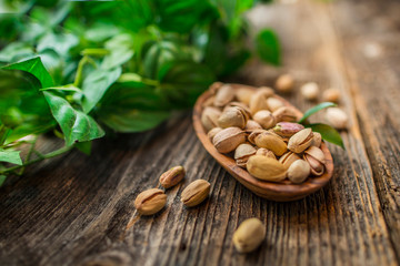 Pistachios on a wooden table.