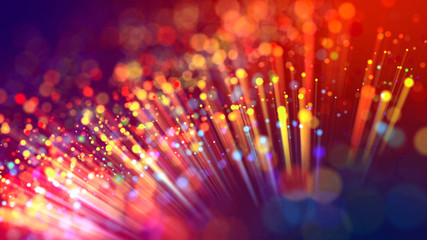 Abstract explosion of multicolored shiny particles or light rays like laser show. 3d render abstract beautiful background with light rays colorful glowing particles, depth of field, bokeh.