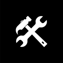 Wrench and hammer icon isolated on black background