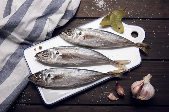 Fresh mackerel fish on cutting board ready to cook. Raw seafood