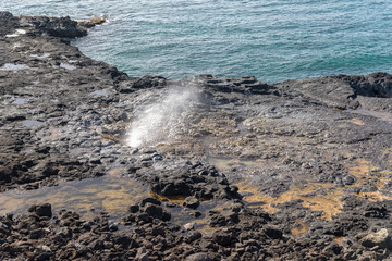 waves breaking on the rocks
