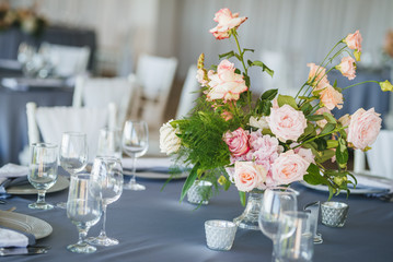 Luxury wedding table decoration. Special event table set up. Fresh flower decoration. Pastel colors - blue and pink decoration