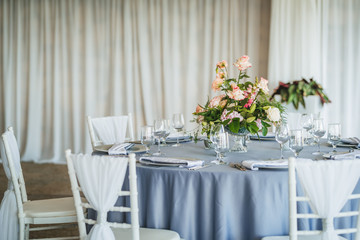 Luxury wedding table decoration. Special event table set up. Fresh flower decoration. Pastel colors - blue and pink decoration