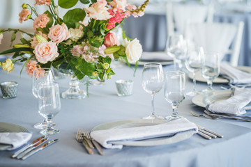 Luxury wedding table decoration. Special event table set up. Fresh flower decoration. Pastel colors - blue and pink decoration