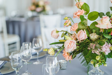 Obraz na płótnie Canvas Luxury wedding table decoration. Special event table set up. Fresh flower decoration. Pastel colors - blue and pink decoration
