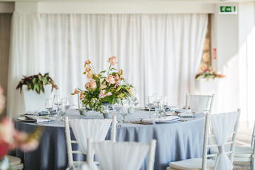Luxury wedding table decoration. Special event table set up. Fresh flower decoration. Pastel colors - blue and pink decoration