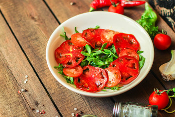 healthy salad tomatoes (vegetables, onions, greens, lettuce, sunflowers, microgreens and more) menu concept. food background. copy space. Top view