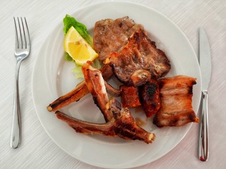 mixed roast meat on the plate