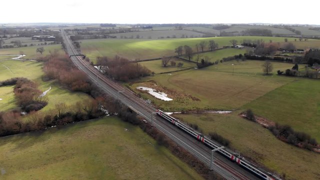 Aerial View Of Train On Kettering To London Railway Line Northamptonshire Landscape