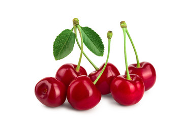 Some cherries with leaf closeup isolated on white background