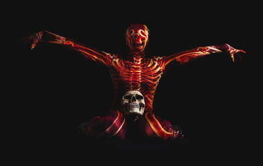 sensual woman dressed in a skeleton costume sitting on floor