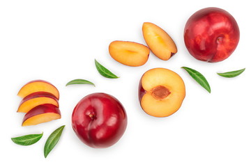 fresh red plum and half with leaves isolated on white background with copy space for your text. Top view. Flat lay