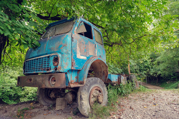 Old abandoned truck in the forest
