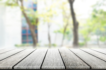 Wood flooring with glass office. atmosphere around office  blur background with bokeh.