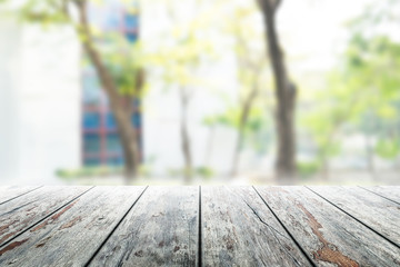 Fototapeta premium Wood flooring with glass office. atmosphere around office blur background with bokeh.