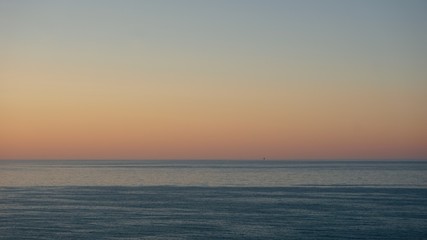 Fototapeta premium Sunset over Adriatic sea with mining platform in the distance