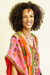 thin woman smiling with afro hair, white background freestyle