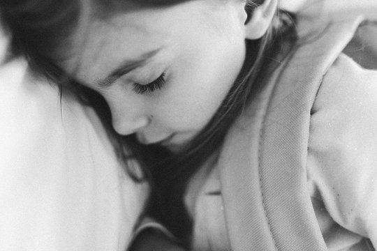 black and white closeup of sleeping child