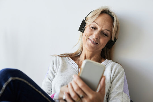 Senior Woman Using Technology At Home.