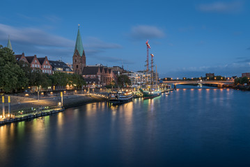 Fototapeta na wymiar Bremen Cityscape on the Weser River after the sunset, Germany