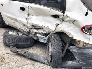 Fototapeta na wymiar damaged automobile after collision in city
