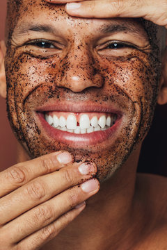 Close up of man's face covered with facial mask