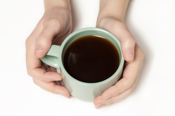 woman holding green cup of coffee tea isolated on white closeup