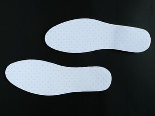 Inseat insole in white shoes On a black background