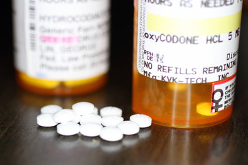 Opiod prescription pain pills on a table.