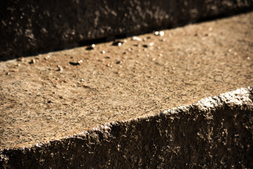 The wet step of the stone staircase is close