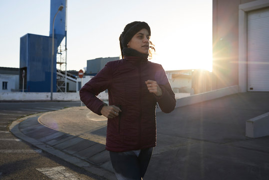 Female runner sunrise exercise.