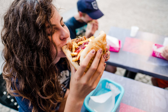 Teen Girl Eating Junk Food In France