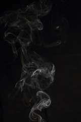 Fototapeta premium Abstract white smoke texture on black background