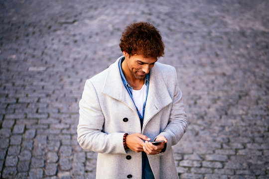 Handsome man using mobile