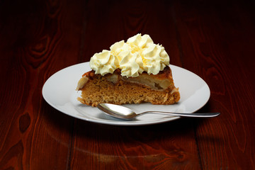 Apple pie is decorated with whipped cream like a cake.