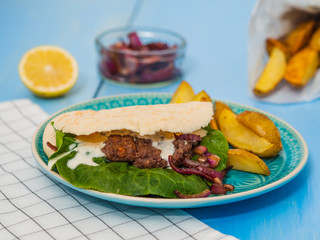 beef burgers with potato wedges