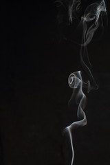 Abstract white smoke texture on black background
