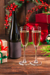champagne and new year, christmas or noel (champagne glass, sparkling wine and gifts on the table) menu concept. food background. copy space. Top view